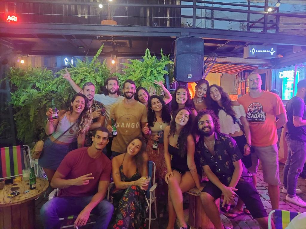 a group of people posing for a picture at a party at Nomads Hostel Multicultural & Coworking in Salvador