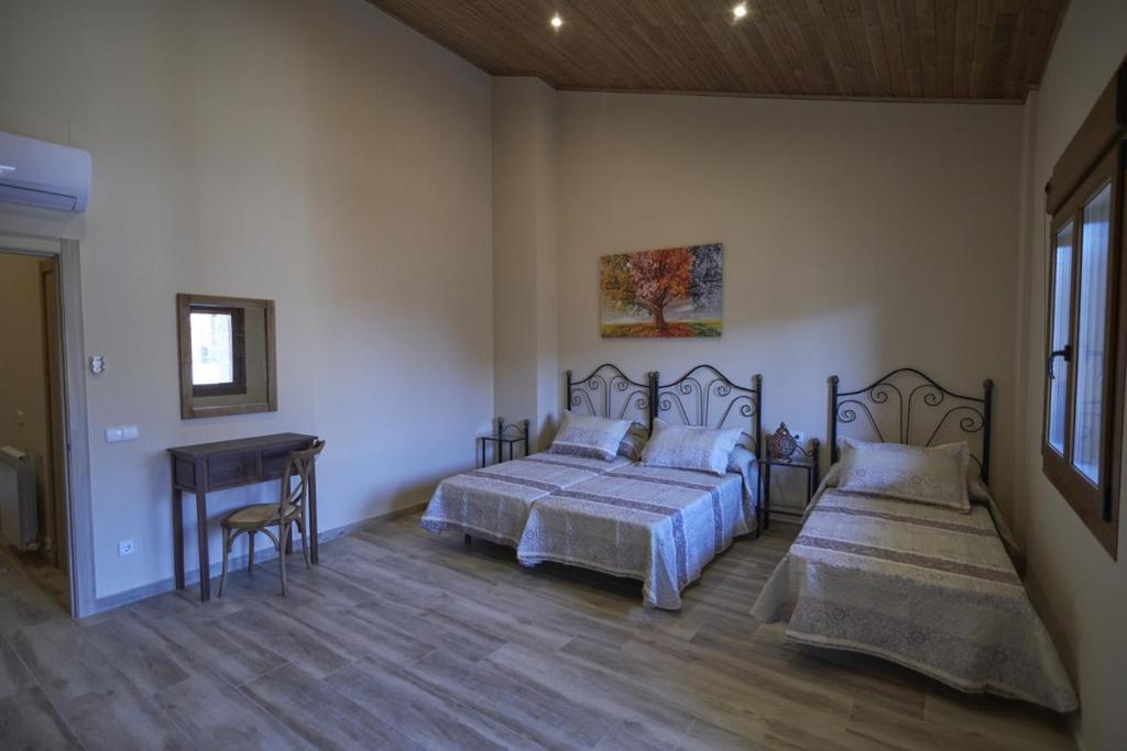 Säng eller sängar i ett rum på La Casa del Lino