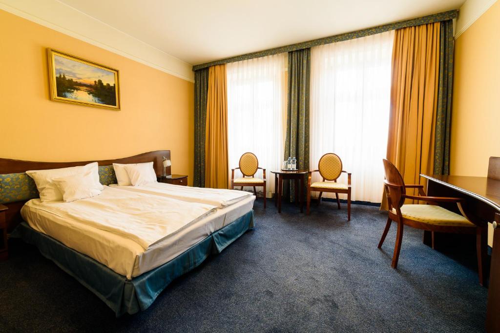 Posteľ alebo postele v izbe v ubytovaní Hotel Ambasadorski Rzeszów