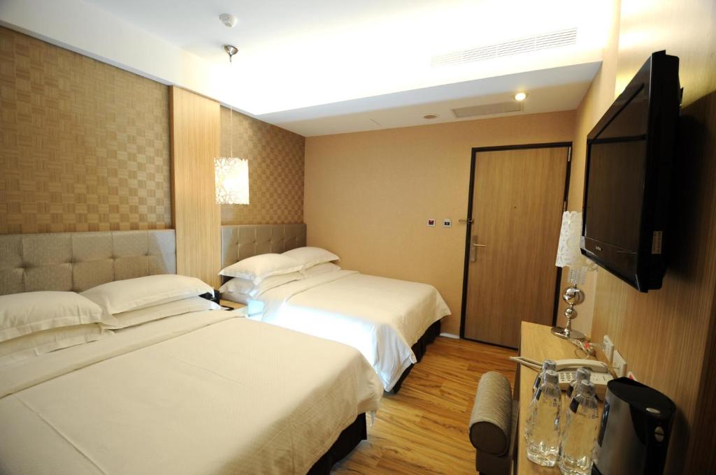 Letto o letti in una camera di The Riverside Hotel Hengchun