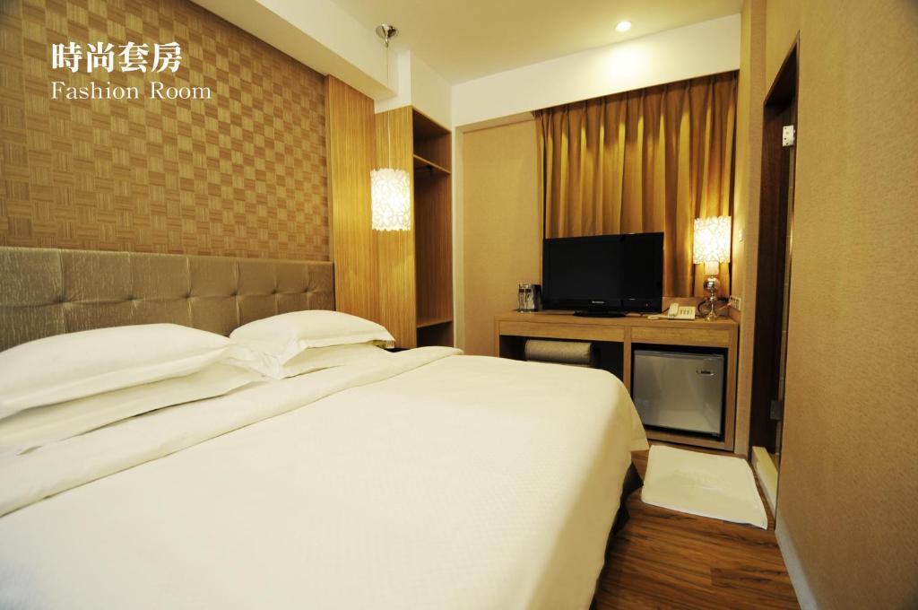 Letto o letti in una camera di The Riverside Hotel Hengchun