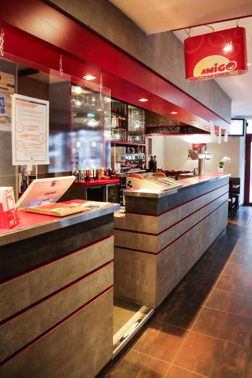 a fast food restaurant with a counter at HOTEL DU COMMERCE in La Châtre