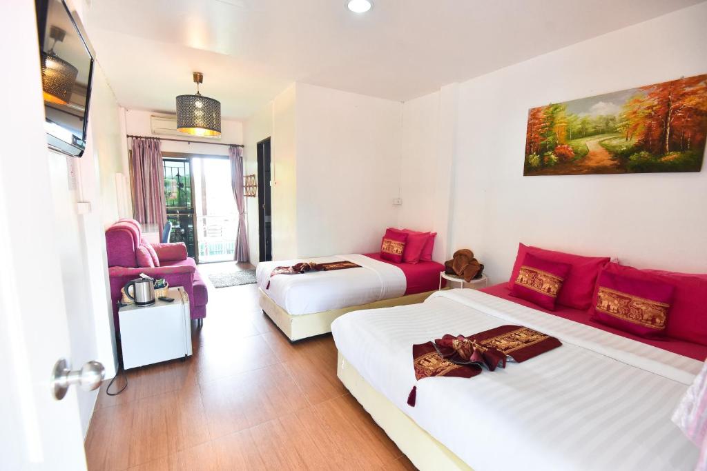 Postel nebo postele na pokoji v ubytování P.U. Inn Resort