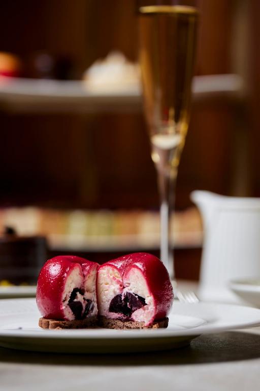 a piece of food on a plate with a glass of wine at The Parkgate Hotel in Cardiff