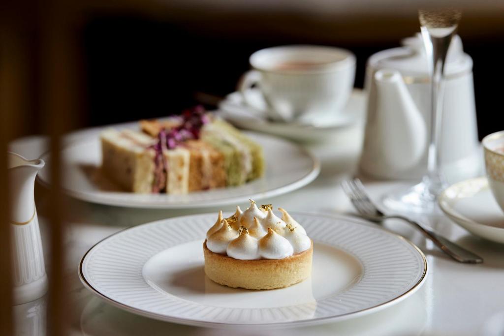 a table with two plates of food on it at The Parkgate Hotel in Cardiff