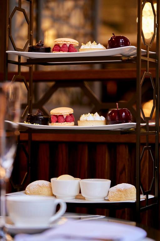 a display of different types of desserts on plates at The Parkgate Hotel in Cardiff