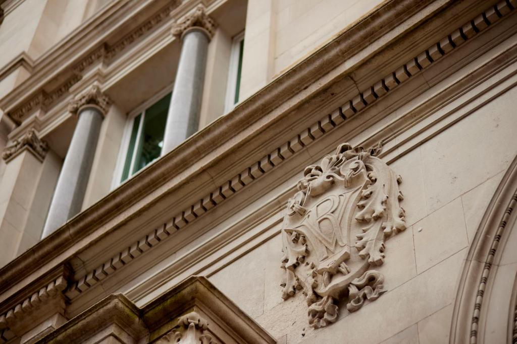 a building with a carving on the side of it at The Parkgate Hotel in Cardiff