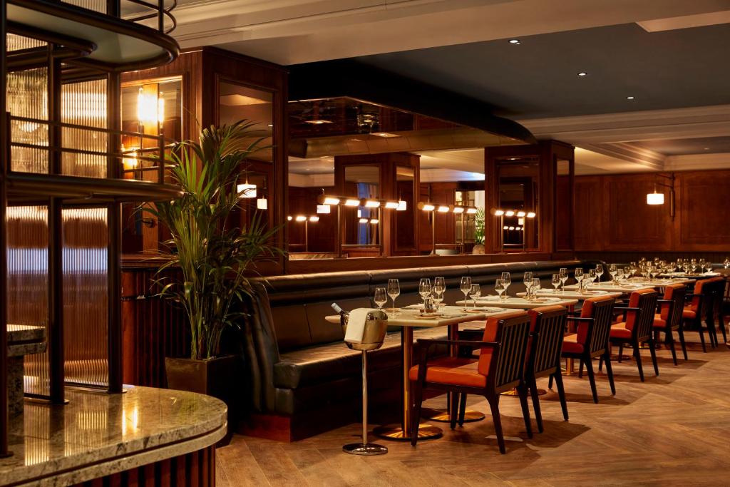 a long dining room with a long table with wine glasses at The Parkgate Hotel in Cardiff