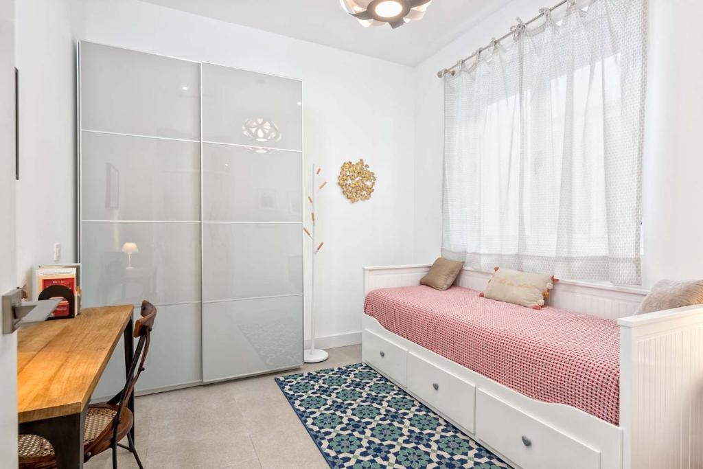 Łóżko lub łóżka w pokoju w obiekcie Casapalma Apartment in Malaga by Solaga Holiday Homes
