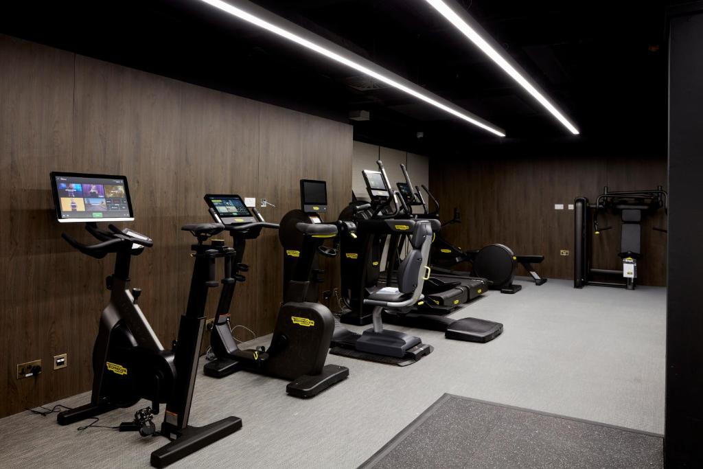 a gym with several treadmills and exercise bikes at The Parkgate Hotel in Cardiff