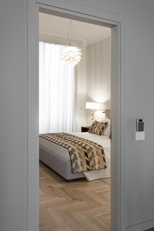 Postel nebo postele na pokoji v ubytování Apollo Suite