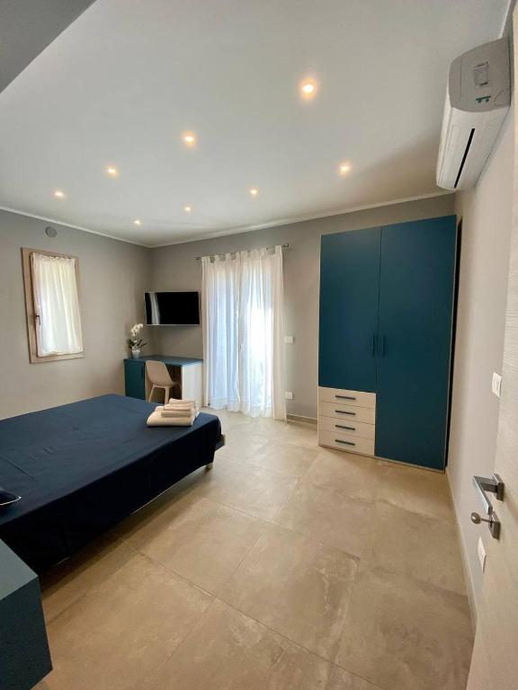 A bed or beds in a room at Floridida Rooms & Breakfast