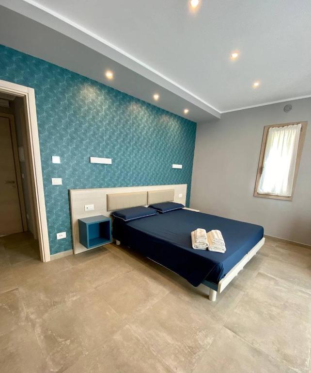 A bed or beds in a room at Floridida Rooms & Breakfast