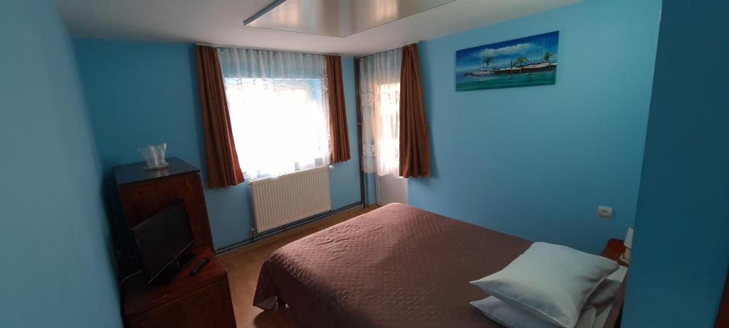 Postel nebo postele na pokoji v ubytování Pensiunea Aurora - Great Hostel Voineasa