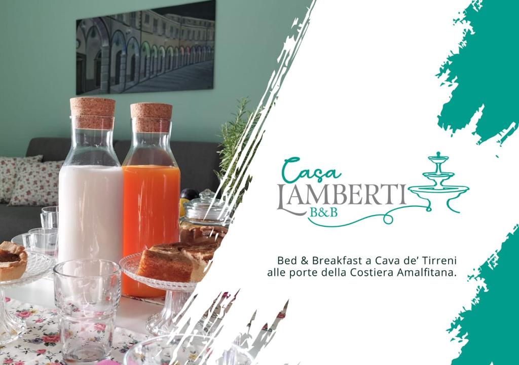 a table with two bottles of milk and glasses at Casa Lamberti B&B in Cava deʼ Tirreni
