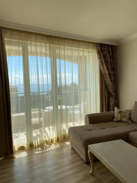 A seating area at Private Super apartments by sea in Apart Hotel !
