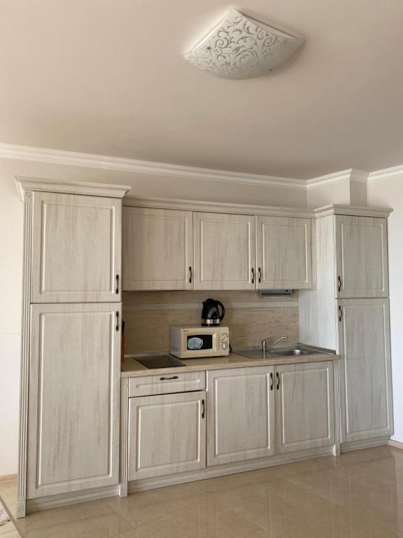 A kitchen or kitchenette at Private Super apartments by sea in Apart Hotel !