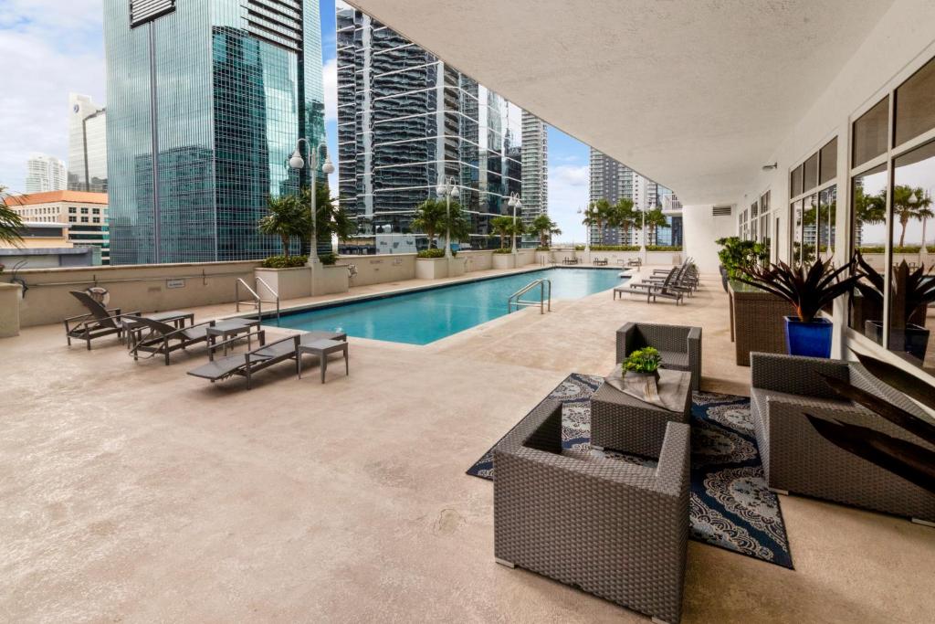a swimming pool on the roof of a building at Luxury Accommodations Brickell in Miami