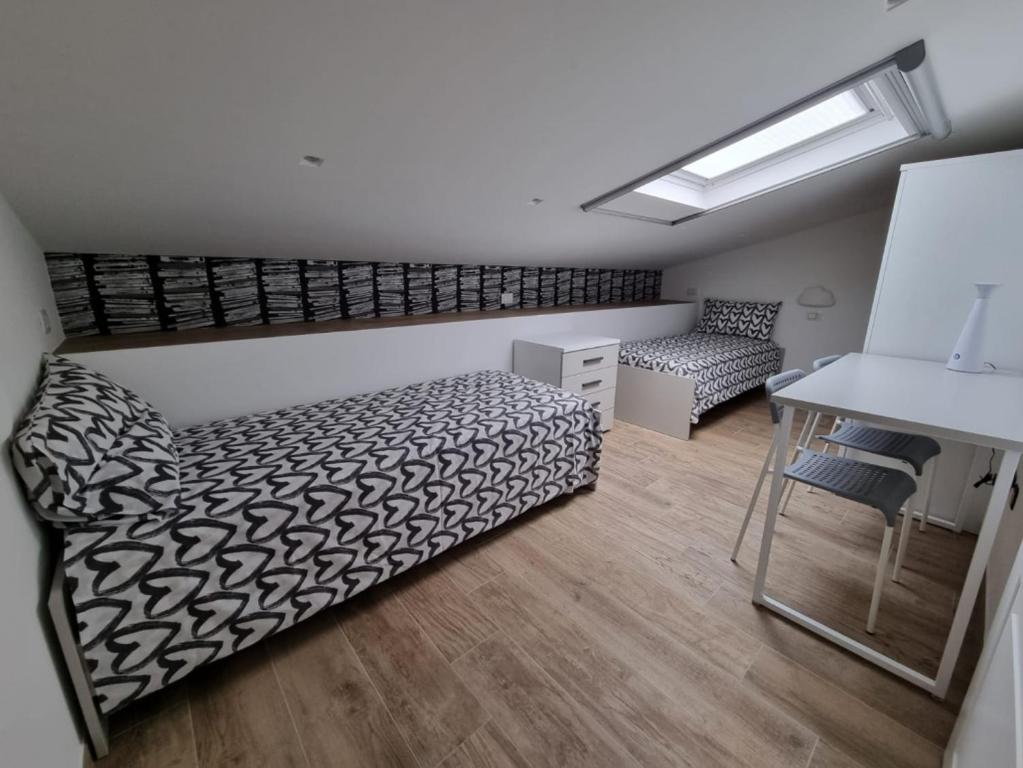 Postel nebo postele na pokoji v ubytování ESA Lodges