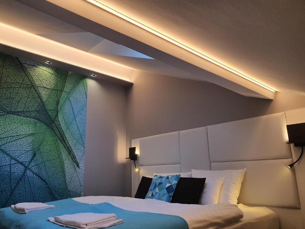 Posteľ alebo postele v izbe v ubytovaní Kaposvár Apartman