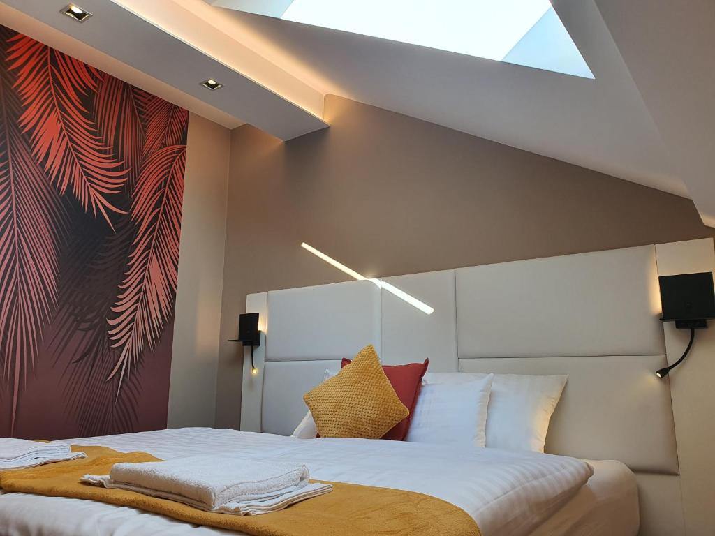Posteľ alebo postele v izbe v ubytovaní Kaposvár Apartman