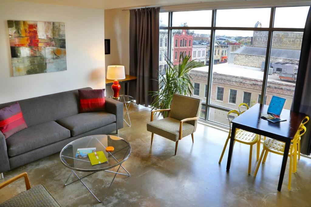 a living room with a couch and a table at Littlefield Lofts #504 in Austin