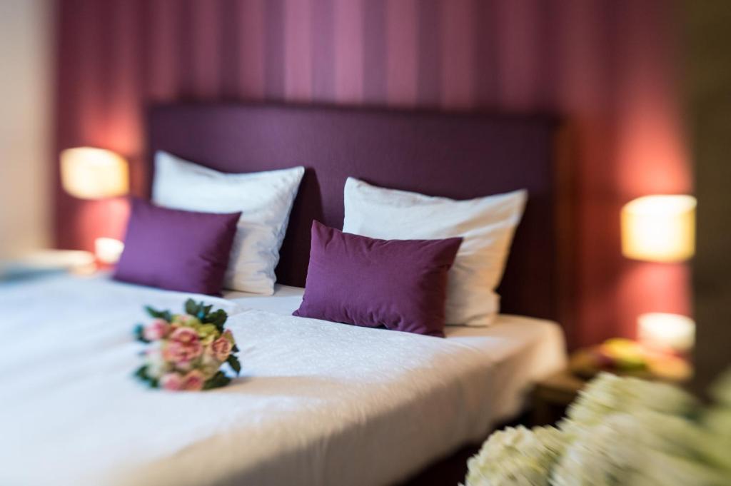 Postel nebo postele na pokoji v ubytování Hotel Chalet Gravenstein