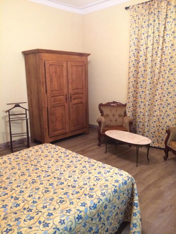 Postel nebo postele na pokoji v ubytování Le Parc aux Cedres