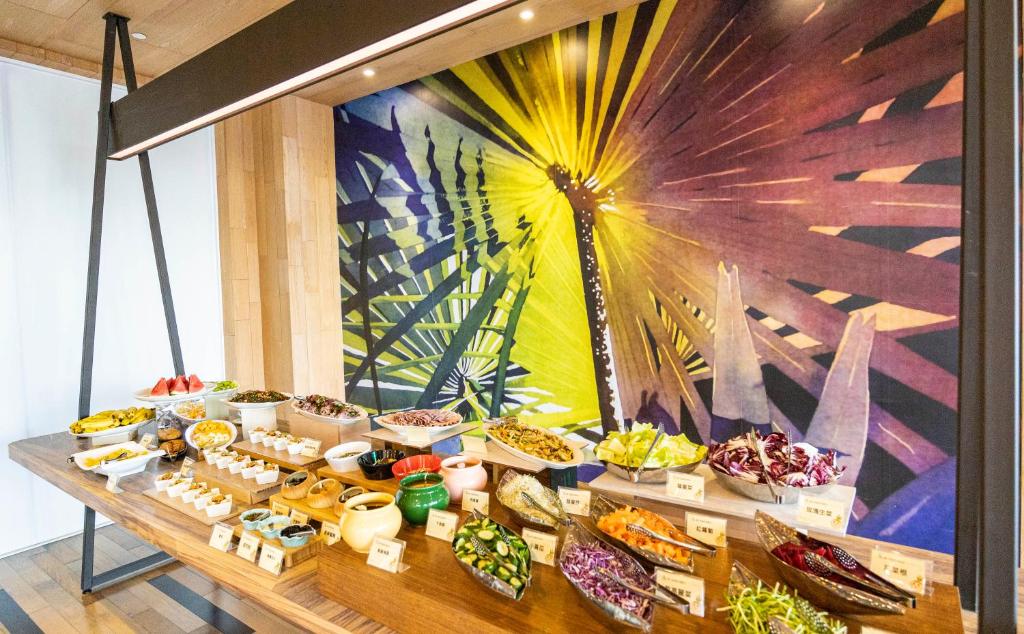 a table with many different types of food on it at Kenting Long Beach Hotel in Checheng