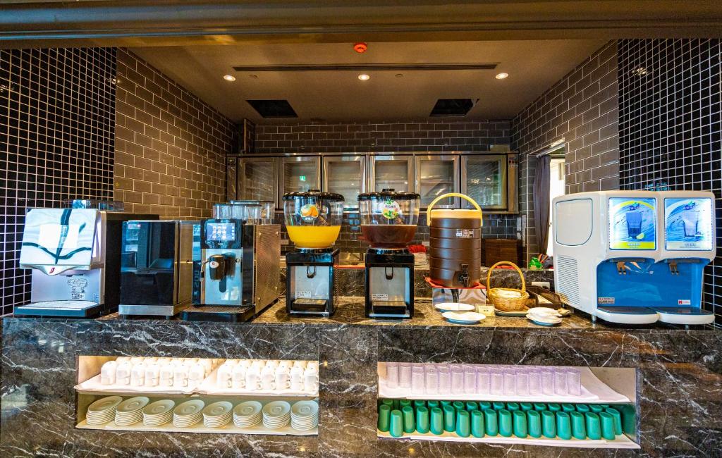 a kitchen with a counter with various appliances on it at Kenting Long Beach Hotel in Checheng