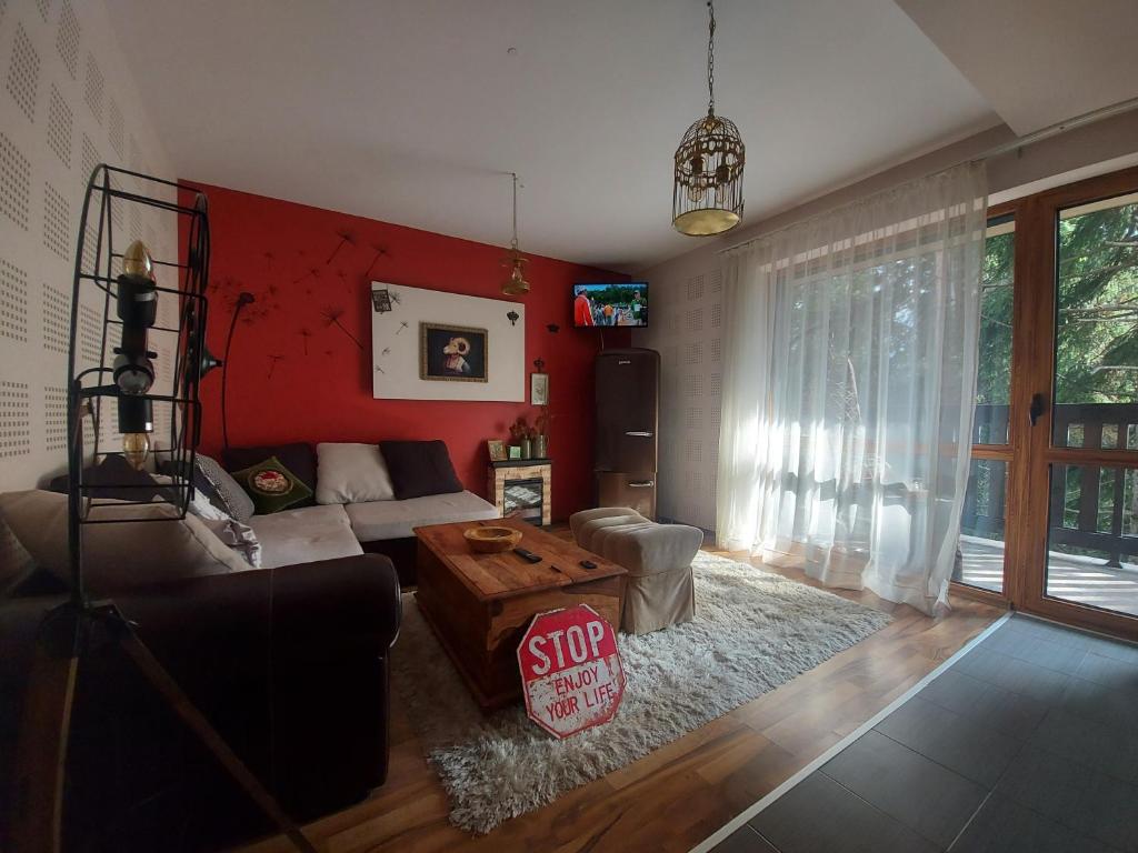 a living room with a stop sign on the floor at 1 Bedroom cozy flat in Pamporovo