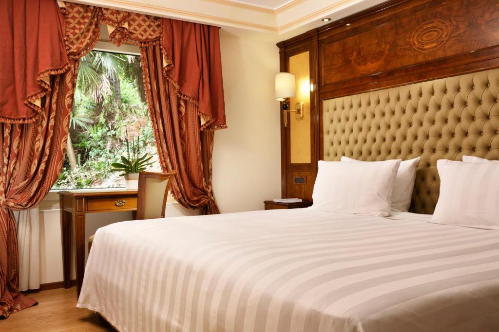 Postel nebo postele na pokoji v ubytování Swiss Diamond Hotel & Spa