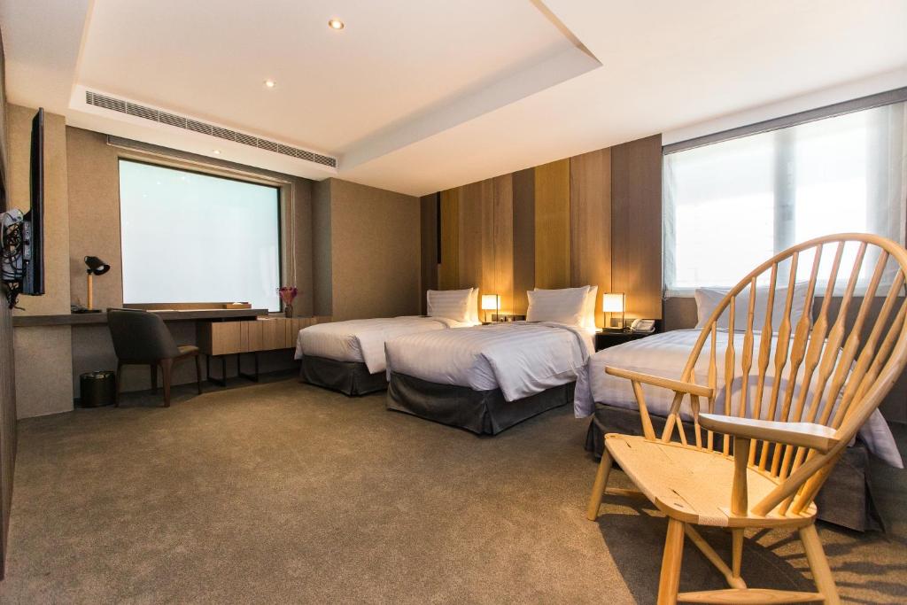 Postel nebo postele na pokoji v ubytování Hotel East Taipei