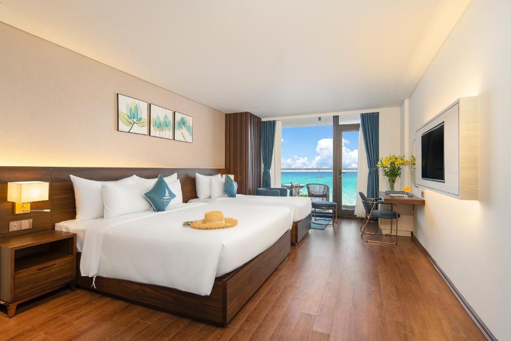 Katil atau katil-katil dalam bilik di Canvas Danang Beach Hotel