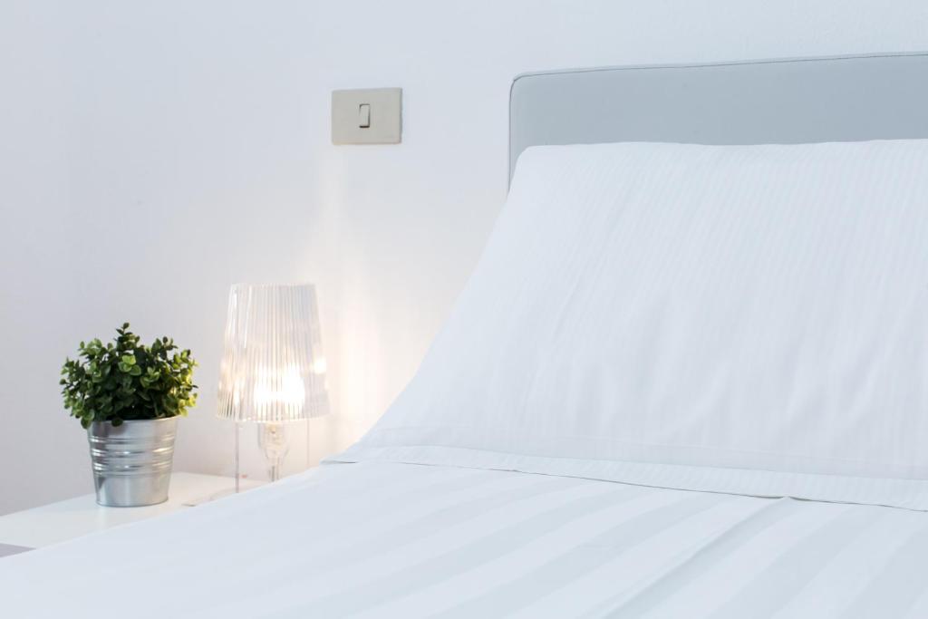 Posteľ alebo postele v izbe v ubytovaní Orbitelli 15 - My Extra Home
