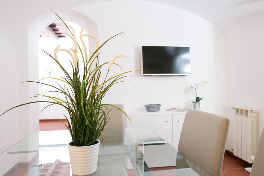 Televízia a/alebo spoločenská miestnosť v ubytovaní Orbitelli 15 - My Extra Home