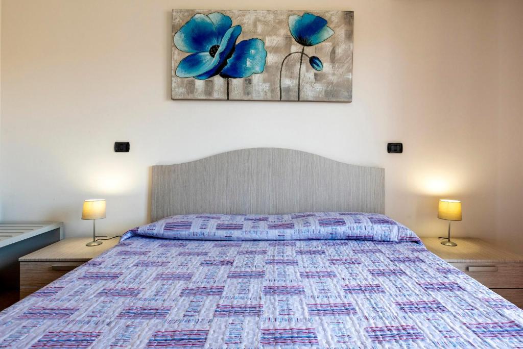 Łóżko lub łóżka w pokoju w obiekcie Egeo apartment
