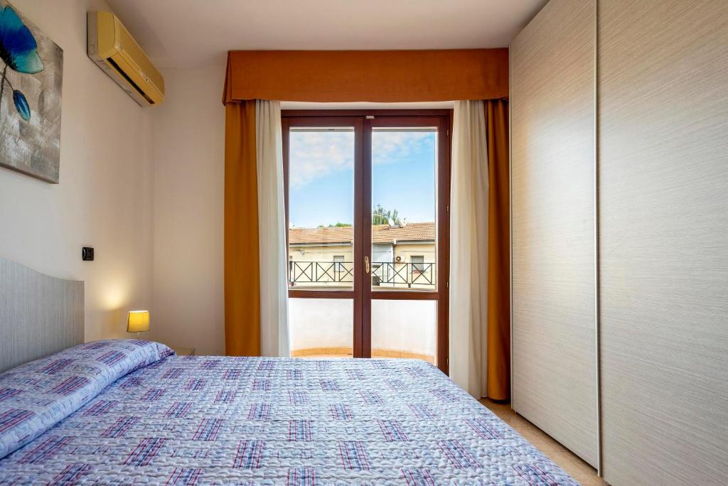 Łóżko lub łóżka w pokoju w obiekcie Egeo apartment