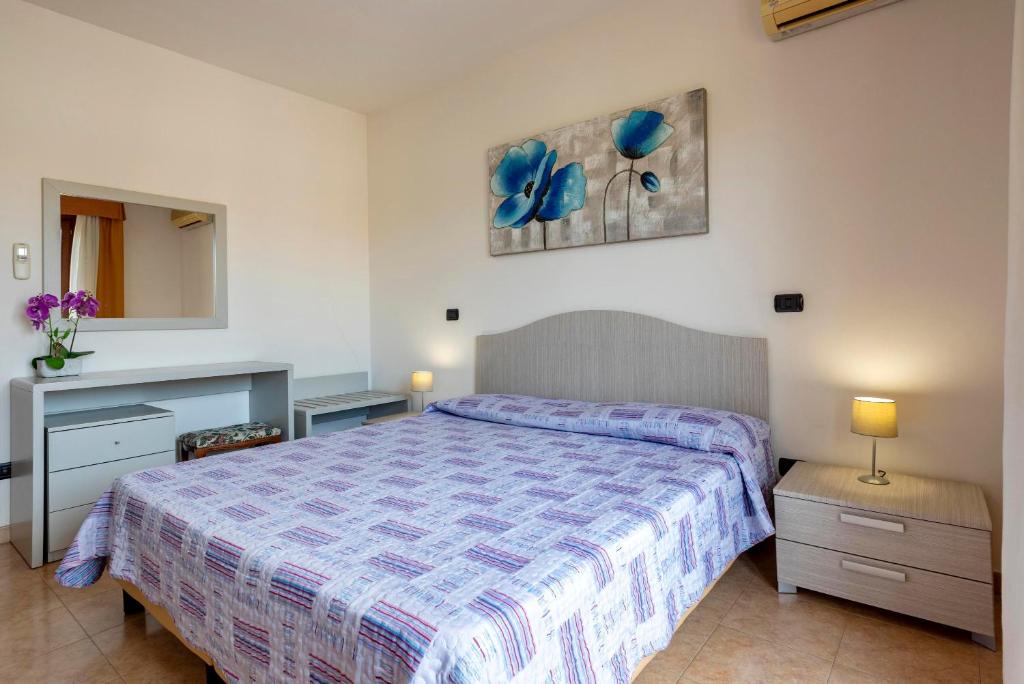 Łóżko lub łóżka w pokoju w obiekcie Egeo apartment