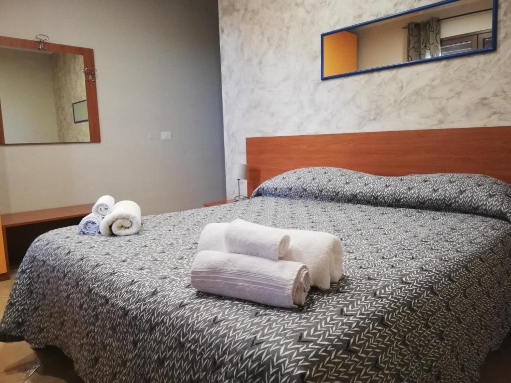 A bed or beds in a room at Anthea Dell' Etna