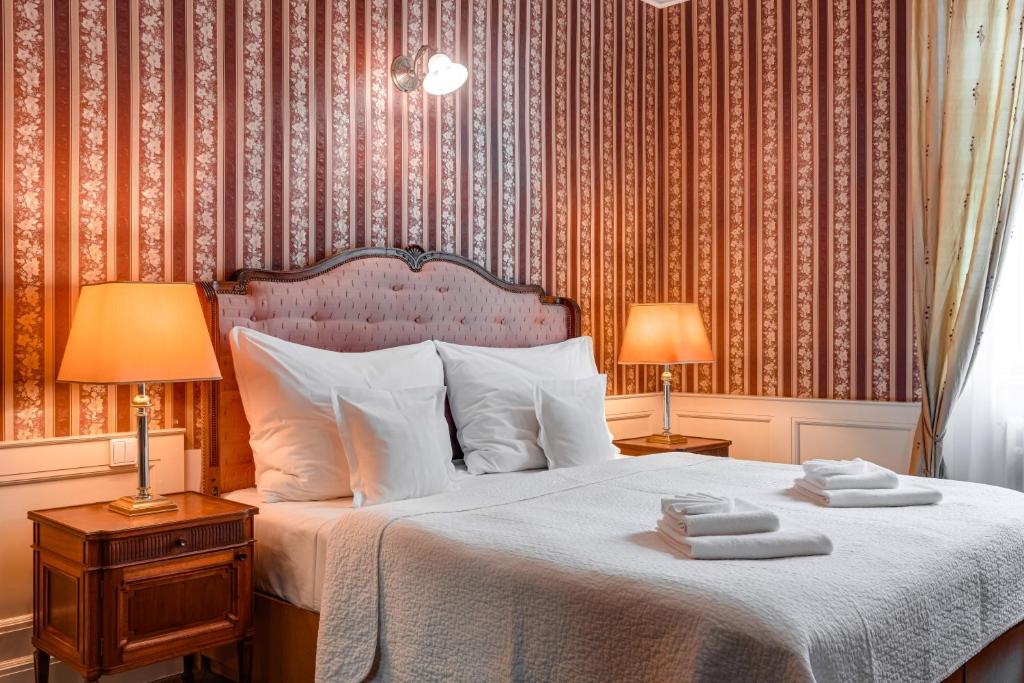 Postel nebo postele na pokoji v ubytování Hotel Praga 1885