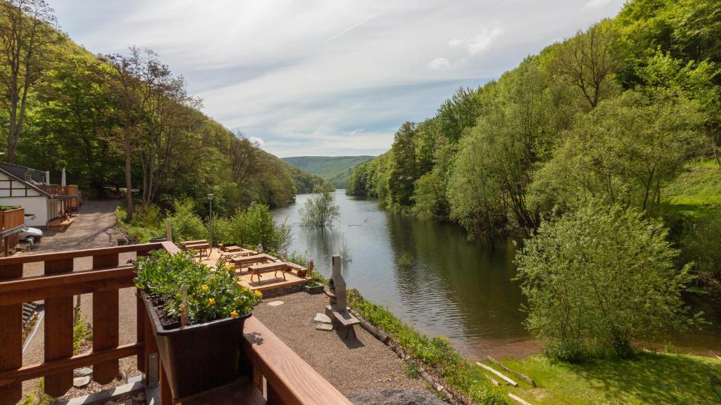 a view of a river from a bridge at Rursee Schilsbachtal - Naturnahe Auszeit am Rursee - Eifel-Ferienwohnungen der besonderen Art in Simmerath