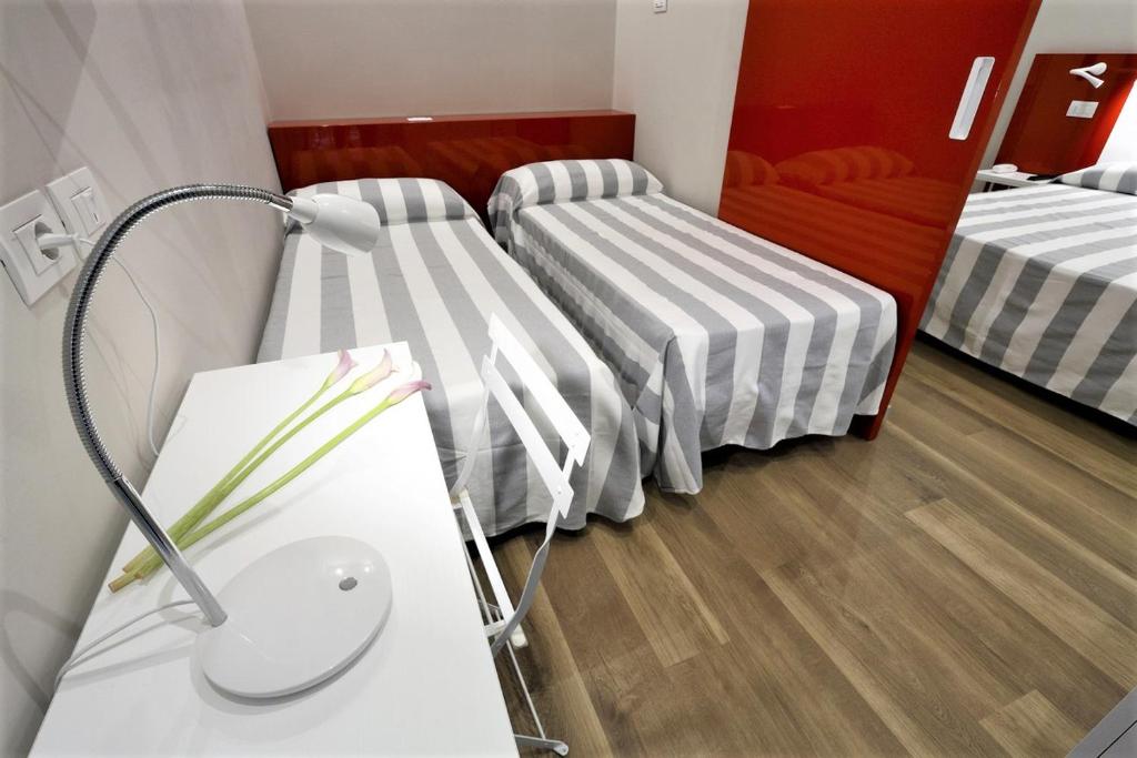 Postel nebo postele na pokoji v ubytování Hotel Aurea