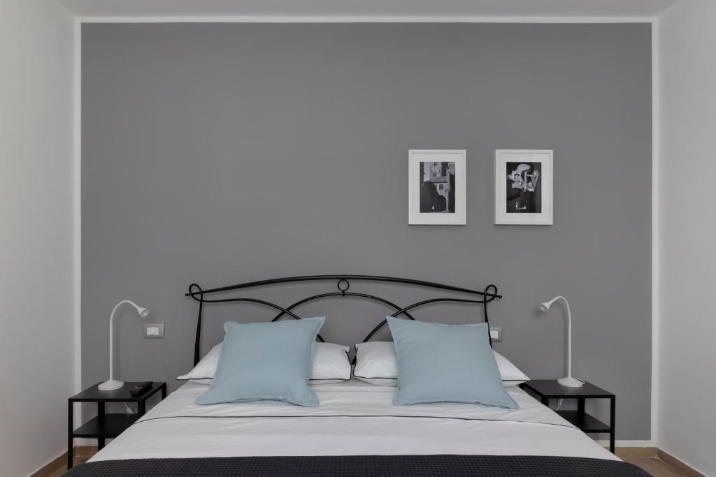 Ένα ή περισσότερα κρεβάτια σε δωμάτιο στο Alloggio San Gemini