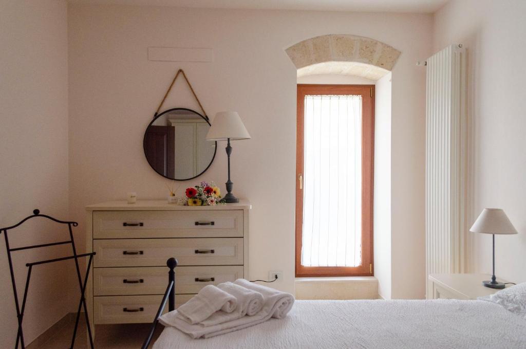 Łóżko lub łóżka w pokoju w obiekcie ANTICA CASA TRECENTESCA