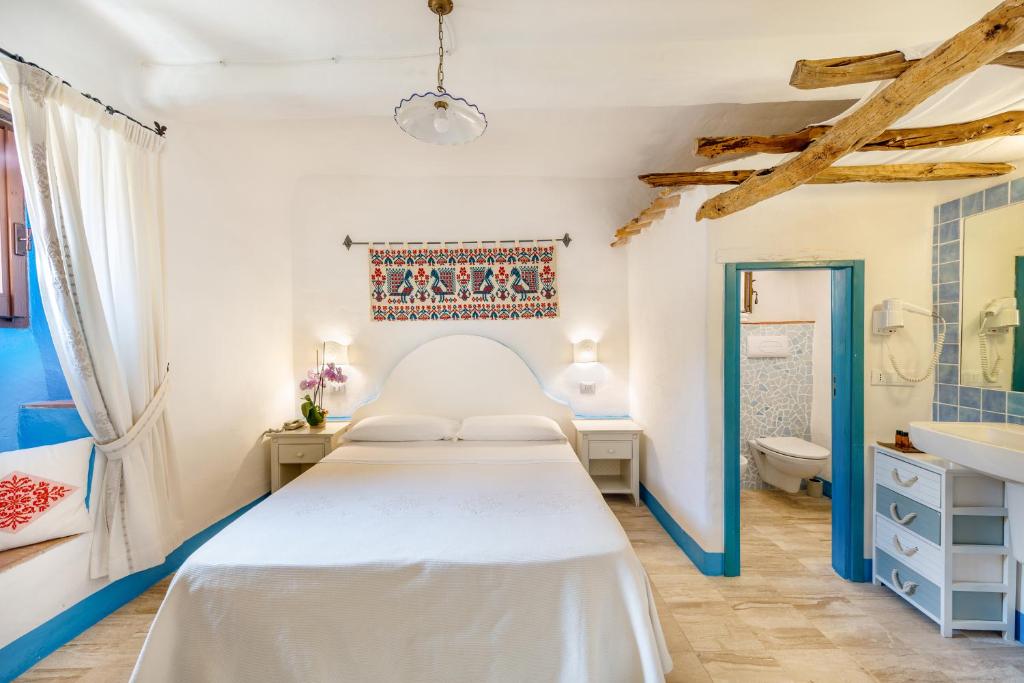 Voodi või voodid majutusasutuse Albergo Diffuso Mannois toas