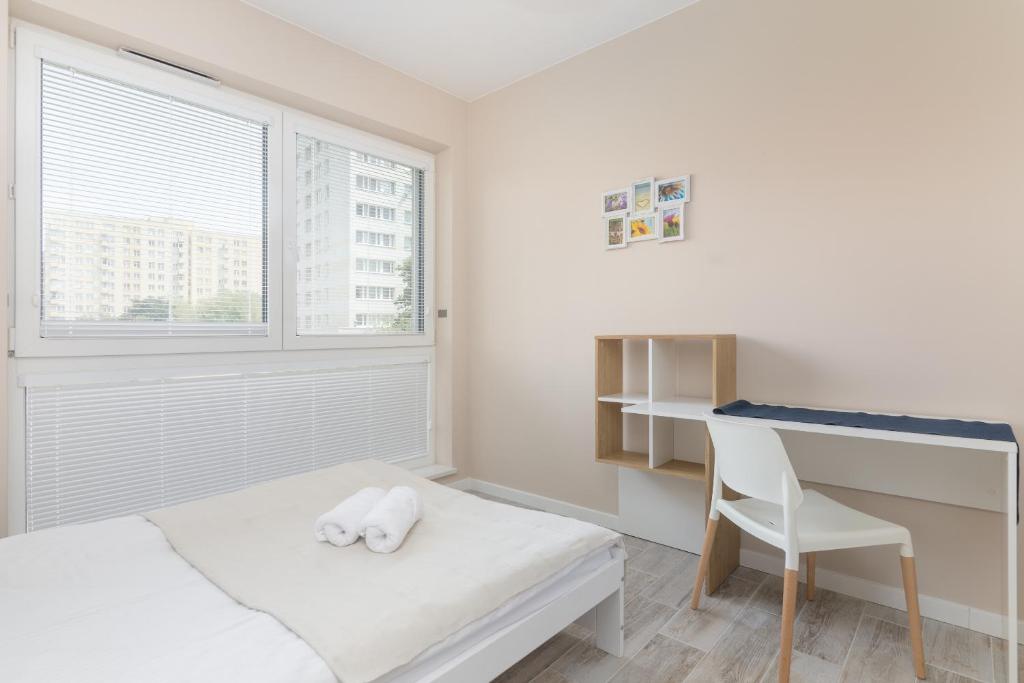 Posteľ alebo postele v izbe v ubytovaní Metro Wilanowska Comfortable Apartment
