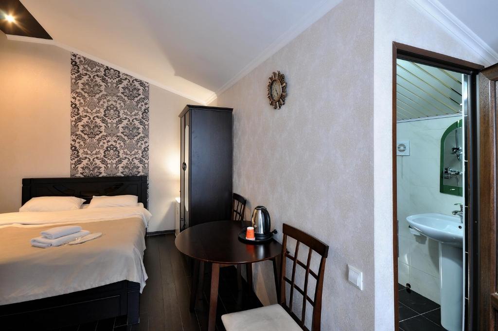 Postel nebo postele na pokoji v ubytování Hotel Majestic
