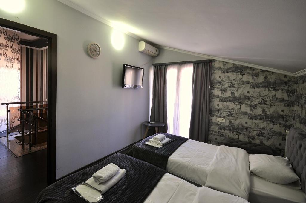 Postel nebo postele na pokoji v ubytování Hotel Majestic
