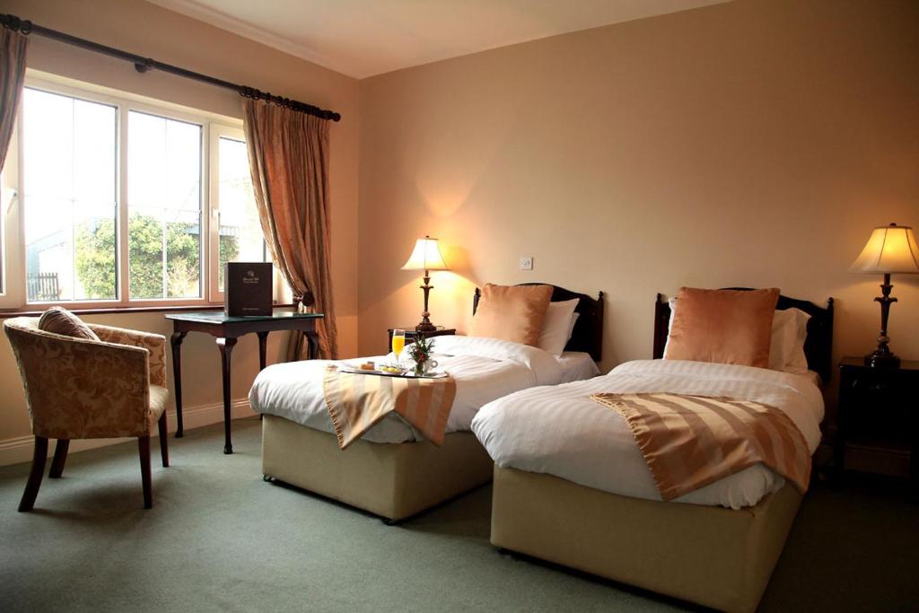 Ένα ή περισσότερα κρεβάτια σε δωμάτιο στο Springfort Hall Hotel